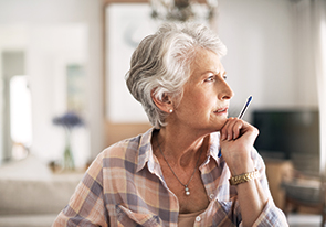 A woman determining her planned giving options. Links to Tangible Personal Property