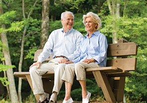 A couple sitting on a bench. Links to Closely Held Business Stock