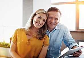 A couple smiling. Links to What to Give