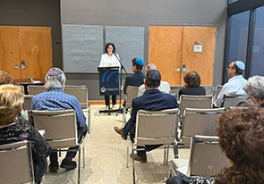 People attending an annual memorial service. Links to Remembering Those Who Created a Jewish Legacy