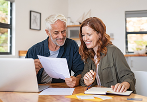 A couple looking at planned giving options. Links to Beneficiary Designations